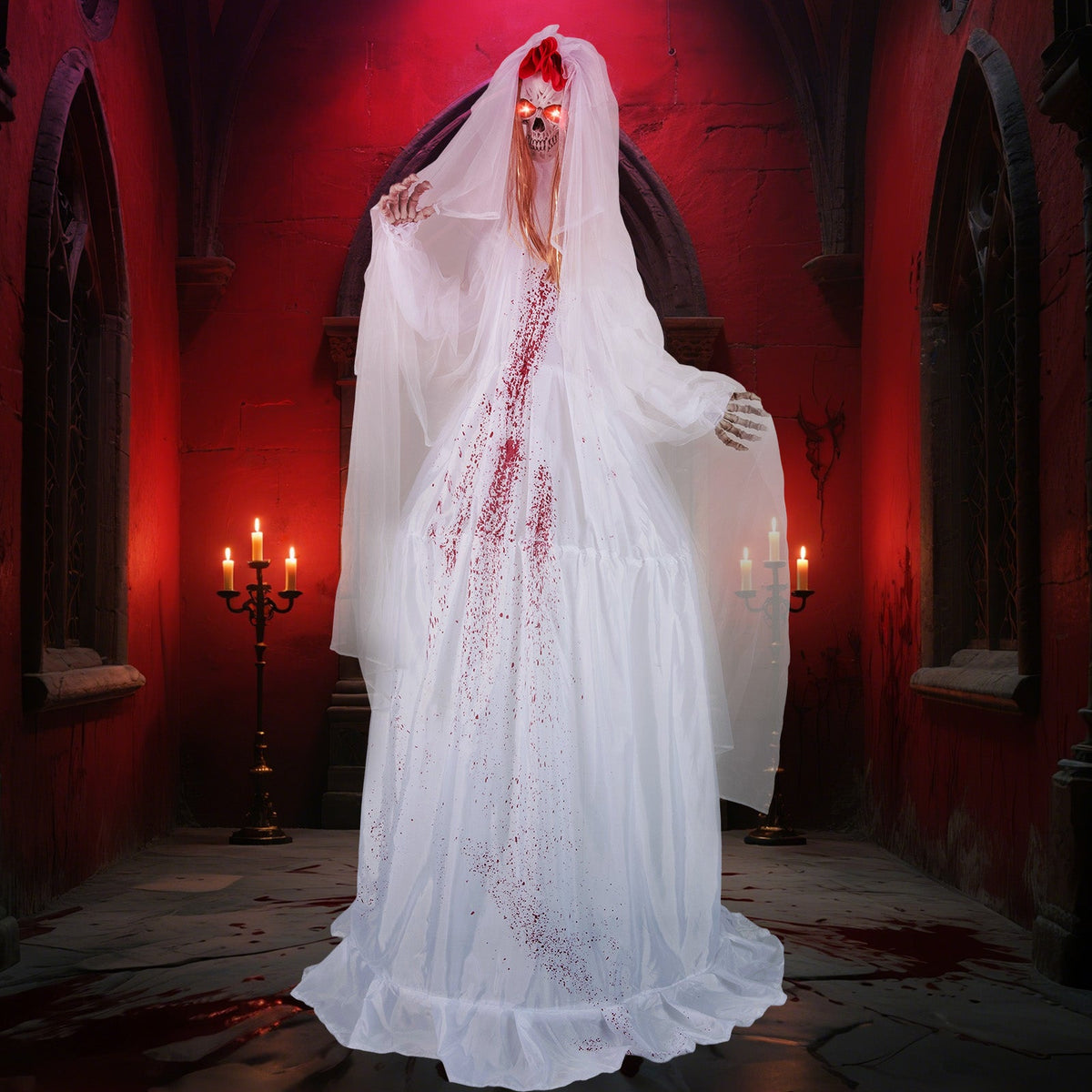Haunted bride decoration in a long white dress and veil with red stains.