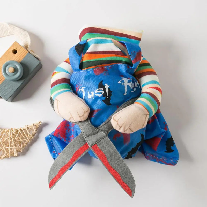 Pet character costume with striped sleeves, an overall-style front, decorative arms and a scissor-shaped detail.