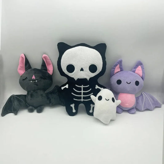 Ghost, skull and bat plush toy styles displayed together.